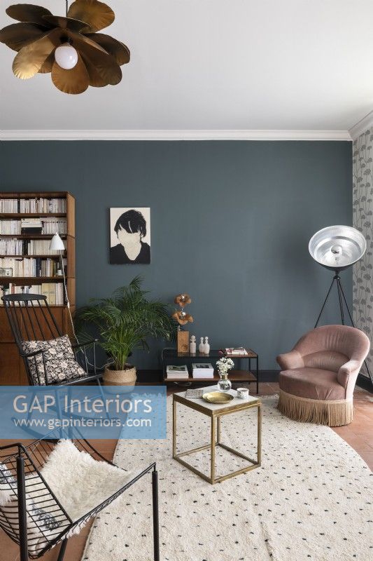 Modern living room with small chairs and grey painted feature wall