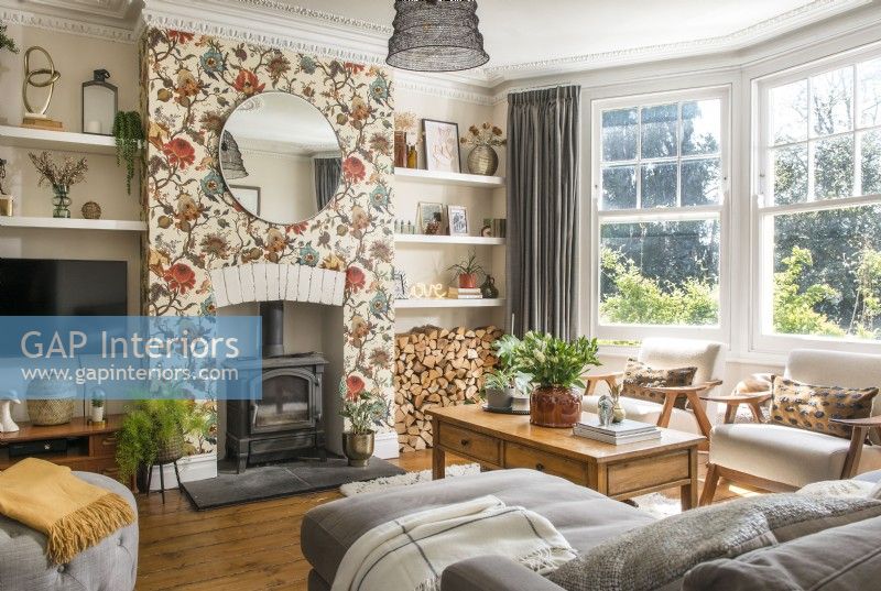 Floral wallpaper on chimney breast in modern living room
