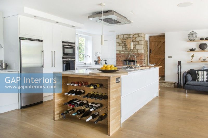 Large island with wine rack in modern country kitchen