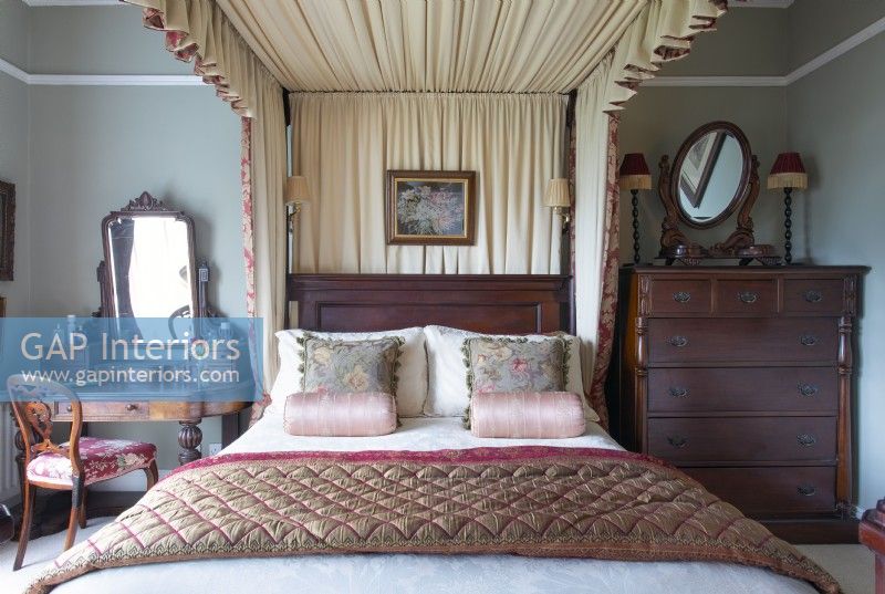 Classic bedroom with four poster bed and canopy