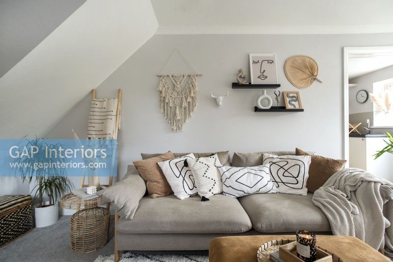 Macrame wall decoration in modern living room - neutral tones