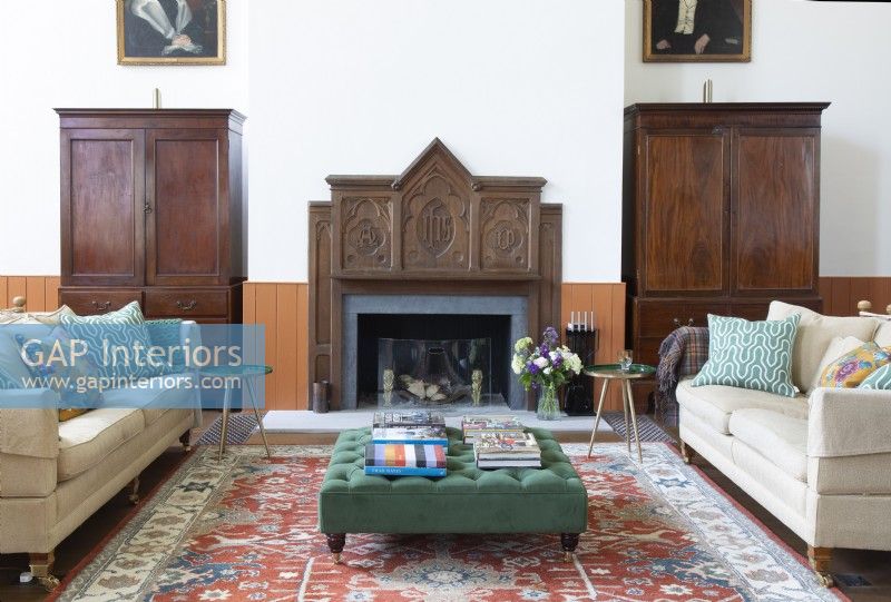 Ornate wooden fire surround in converted chapel living room