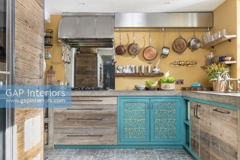 Decorative blue doors on modern kitchen cabinet