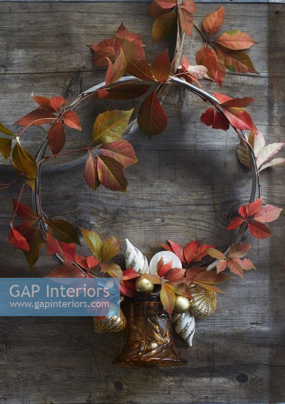 Simple foliage wreath on rustic wooden door