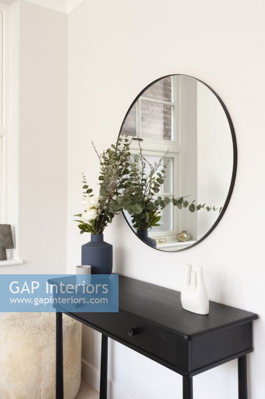Modern black console table with mirror