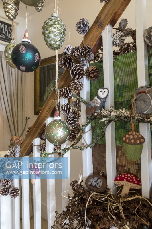 Close up of christmas decorations hanging on staircase bannisters
