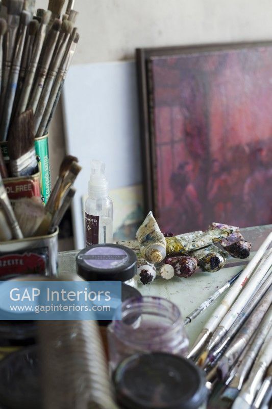 Details in artist's studio, paintbrushes and paints
