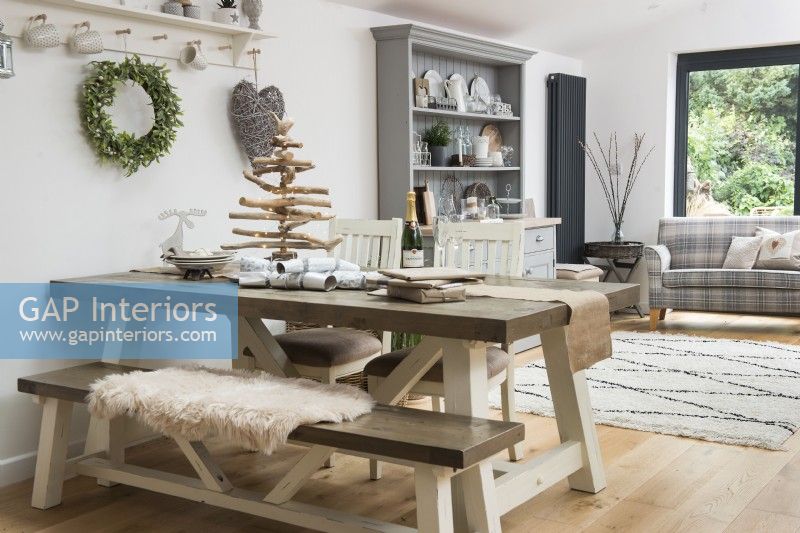 Picnic style dining table in modern dining room at Christmas
