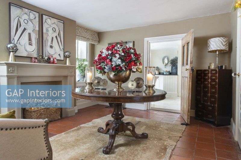 Large floral decoration on classic table in country living room