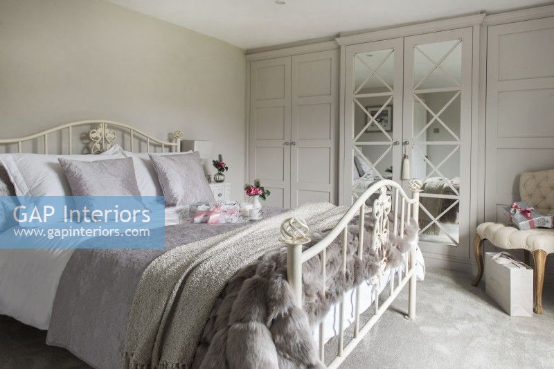 Cream iron bedstead in classic style bedroom