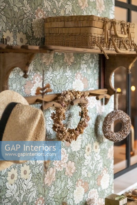 Wicker basket, straw hat and rustic wreaths - detail 