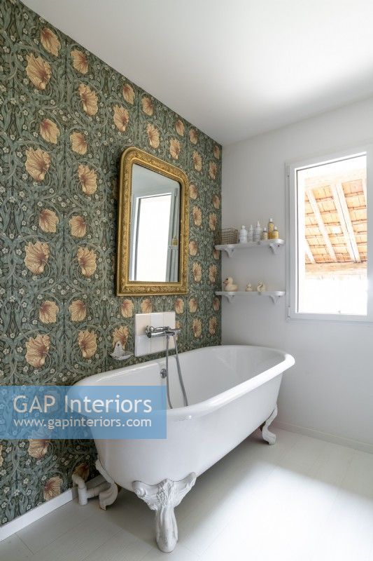 Country bathroom with wallpapered feature wall