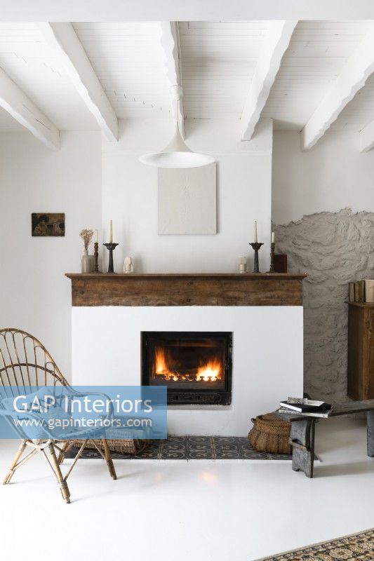 Lit fireplace in country living room