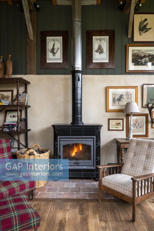 Lit wooden burning stove in country living room