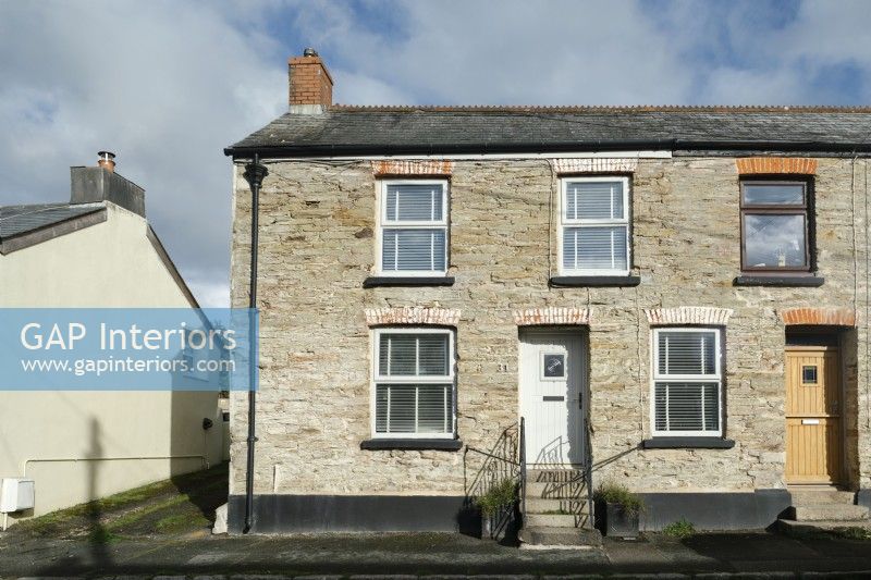 The front exterior of a stone Cornish cottage in Tywardreath, Par.