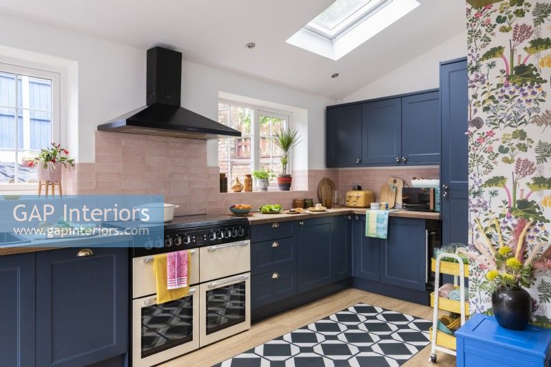 Blue and pink kitchen with black,white and oak vinyl floor tiles