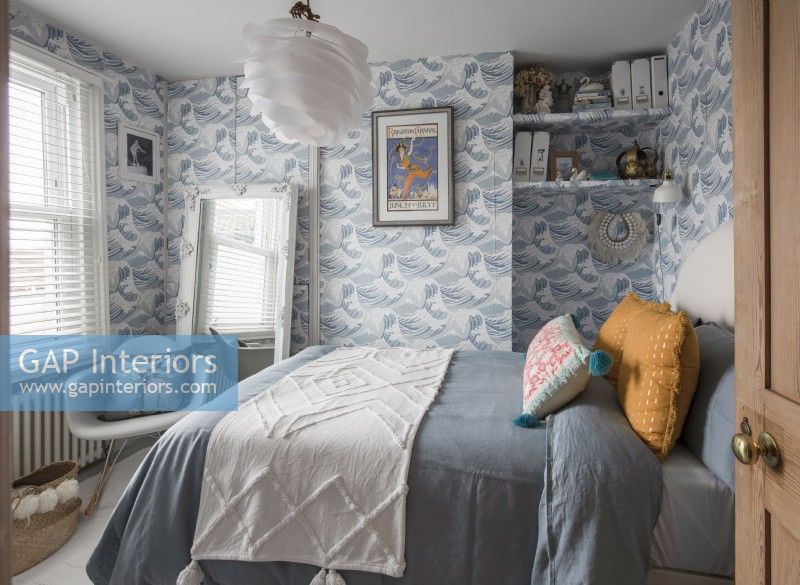 Vintage style bedroom with wave patterned wallpaper