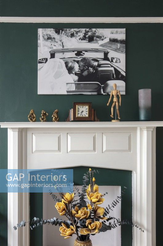 Large wedding photograph above fireplace - detail