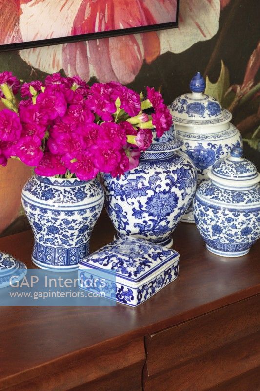 Display of blue and white ceramics and flowers