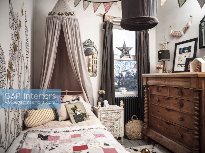 Children's bedroom with bedstead and canopy