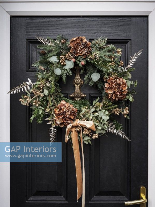 Christmas wreath on black front door