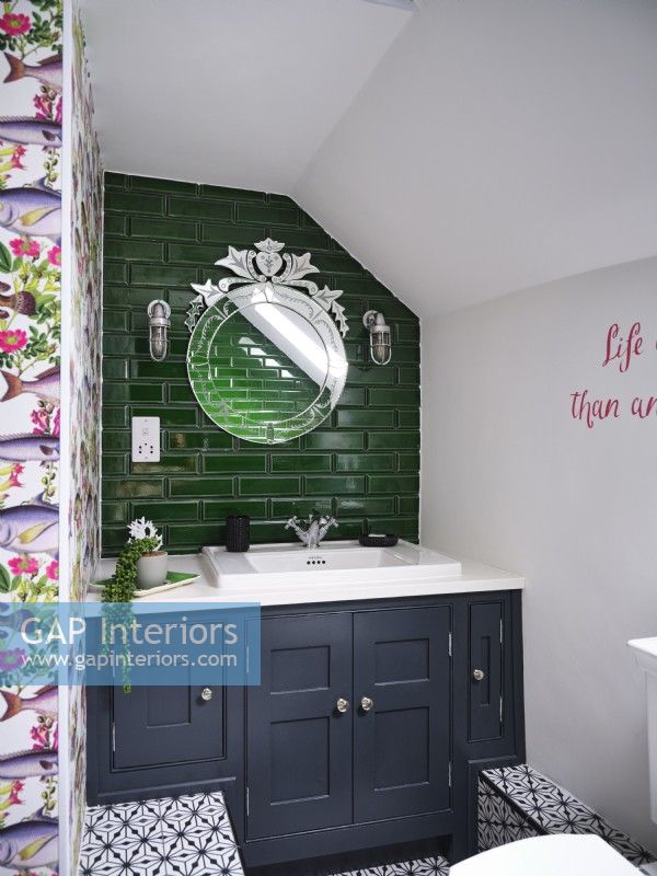 Small green and white bathroom with metro tiles