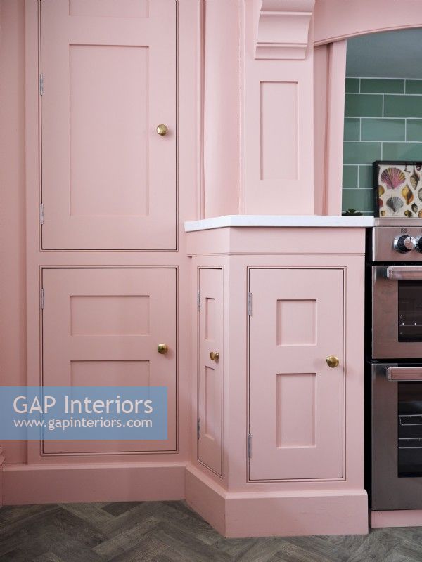 Handmade kitchen with painted pink units