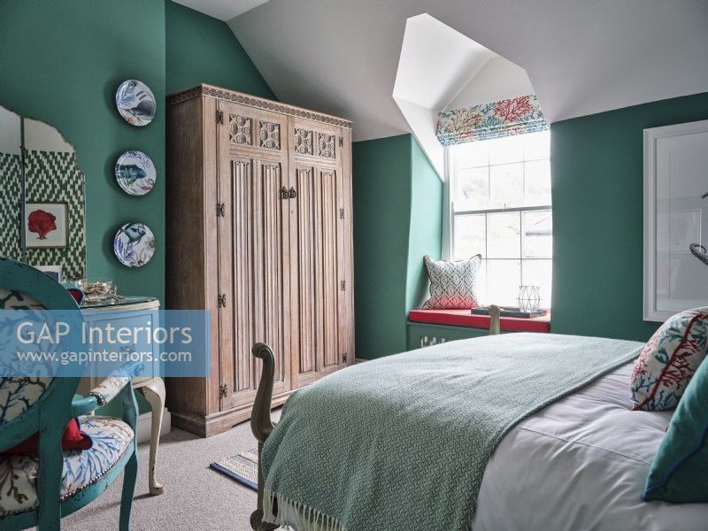 Colourful coastal bedroom in green and white