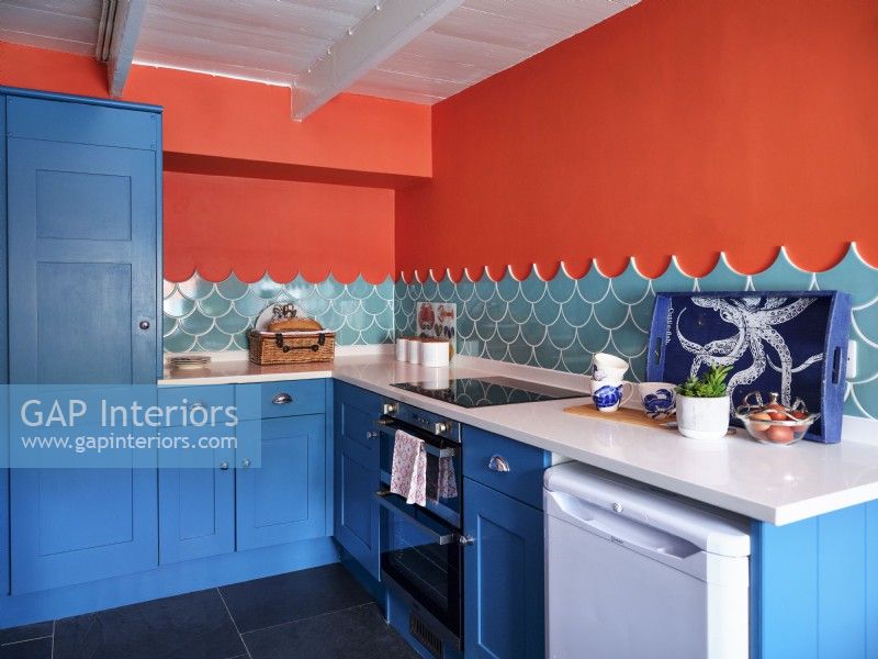 Modern blue kitchen units and sea inspired ceramic kitchen tiles