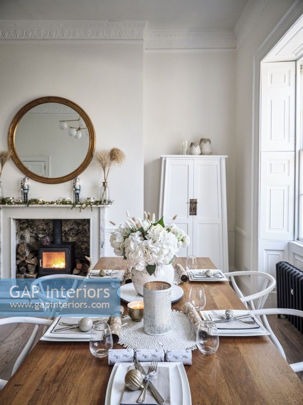 Dining table in Christmas setting in neutral tones