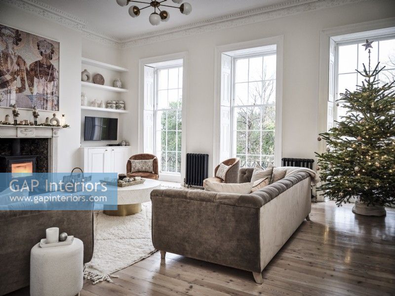 Beige and white furniturshings in grand living room