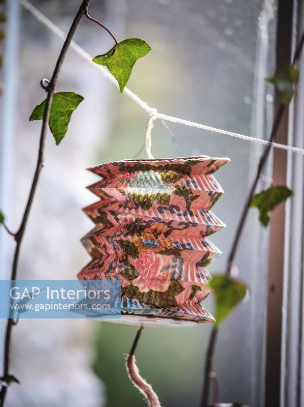 Lantern decoration hanging from window