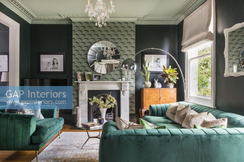 Green modern living room with feature wall chimney breast