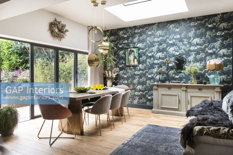 Modern dining room with blue and green feature wall