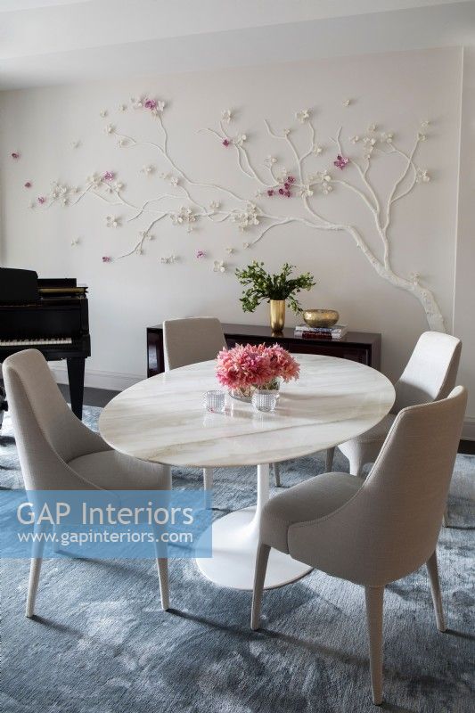 Modern dining room with dogwood tree wall decoration
