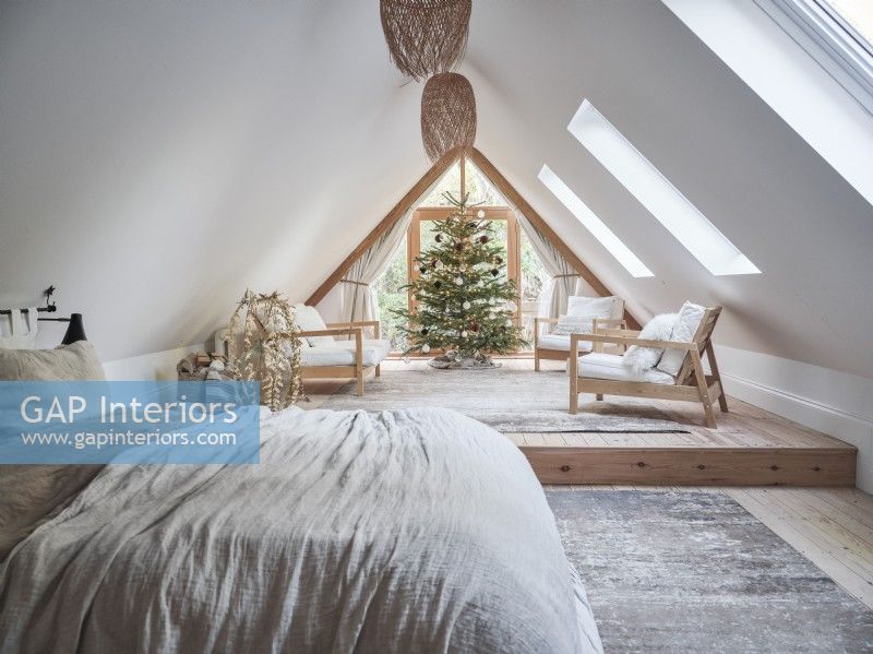 Open plan loft bedroom with neutral tones