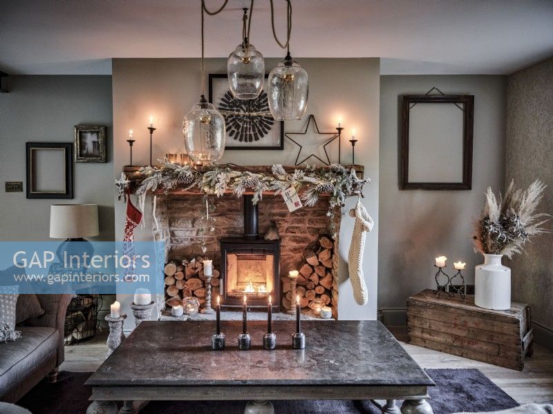 Rustic living room featuring decorative mantel and fireplace