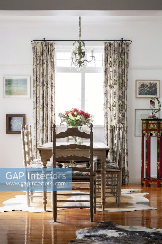 Dining room with embroidered curtains