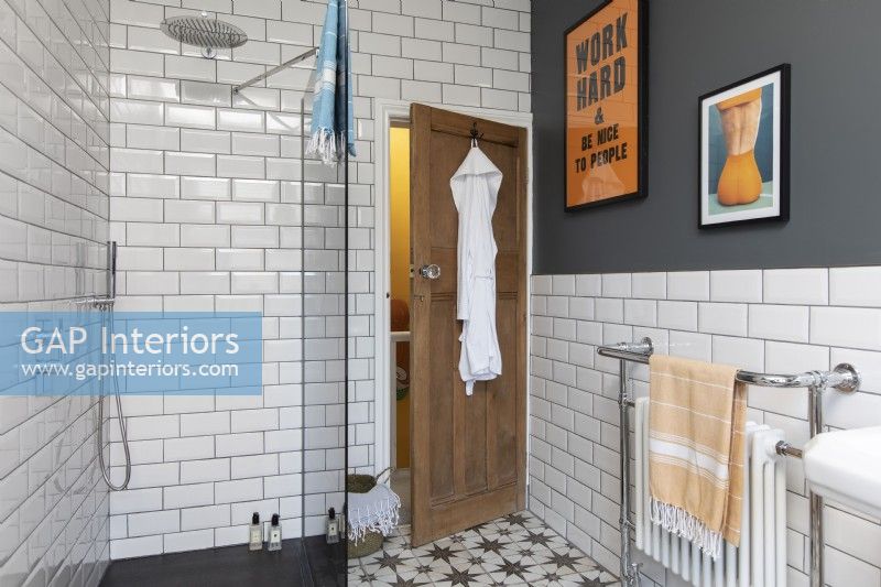 Family bathroom chrome taps, metro tiles and victorian style floor tiles. 