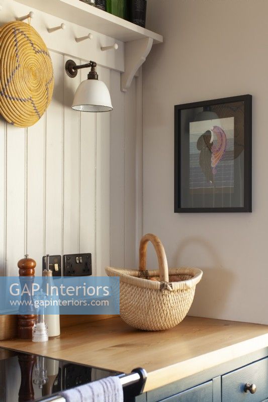 Close up of artwork and light in shaker style kitchen