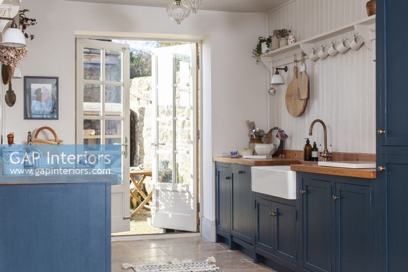 Shaker style country kitchen with painted blue cabinets