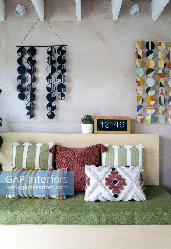 Modern textured cushions and colourful wall hangings