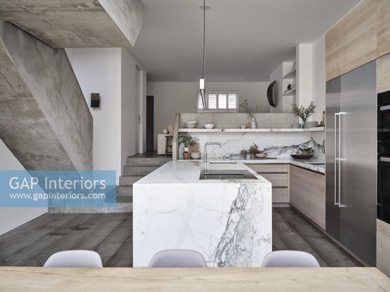 Open plan kitchen diner with concrete steps