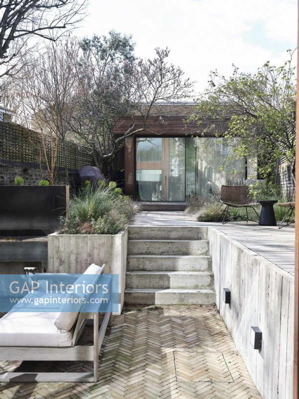 Outdoor space featuring a modern extension
