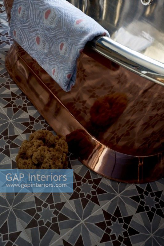 detail of copper coloured roll top bath 