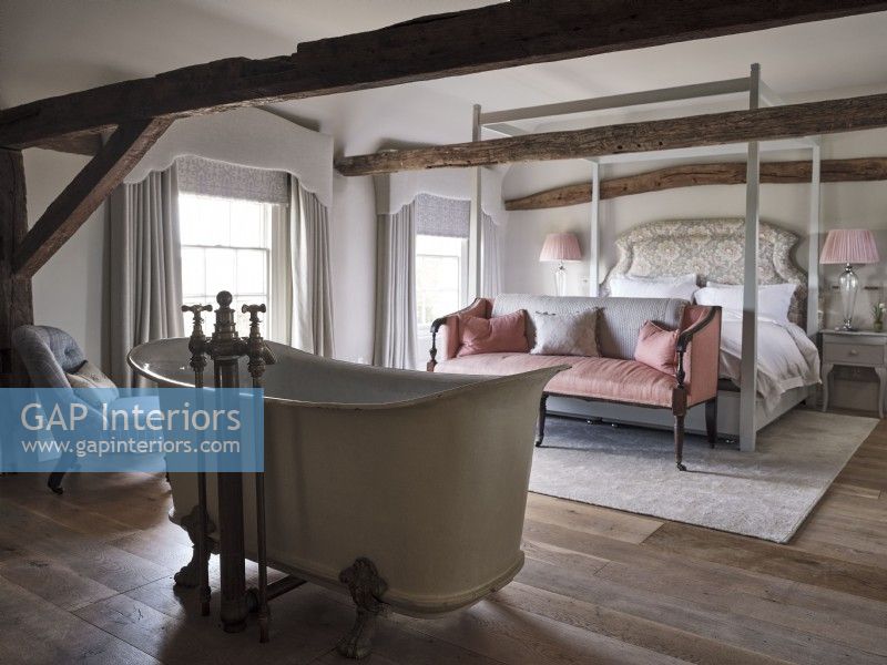 Bedroom with a freestanding bath