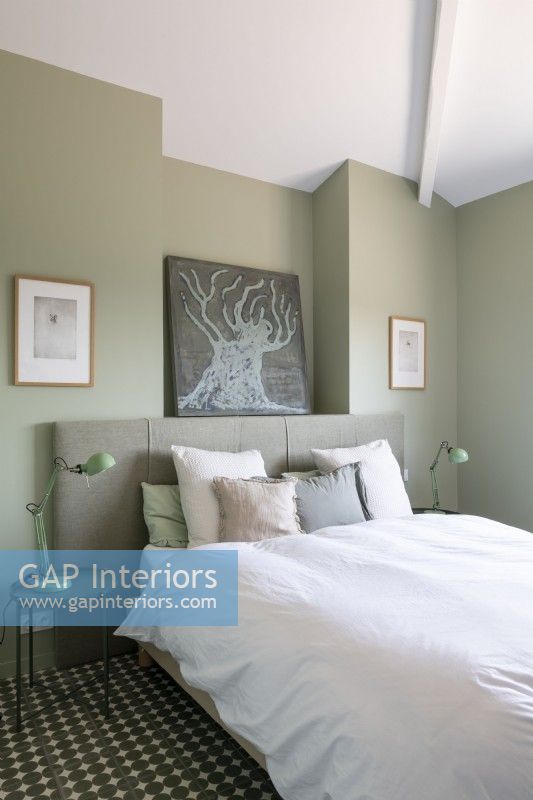Modern bedroom painted in muted tones