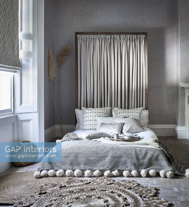 Relaxed bedroom with pleated headboard