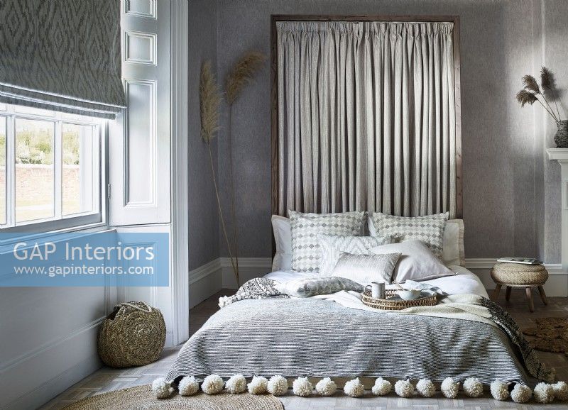 Relaxed bedroom with pleated headboard