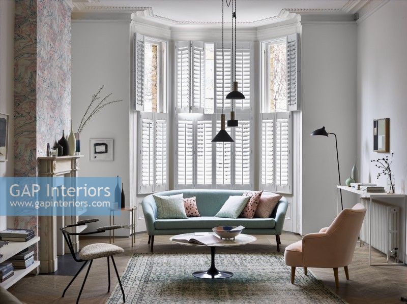 Living room with white shutters